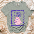 Green t-shirt with "Bride of Fright" text and pink ghost bride graphic.