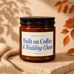 Amber candle with label reading "Smells Like Built on Coffee & Wedding Chaos - Vowed".