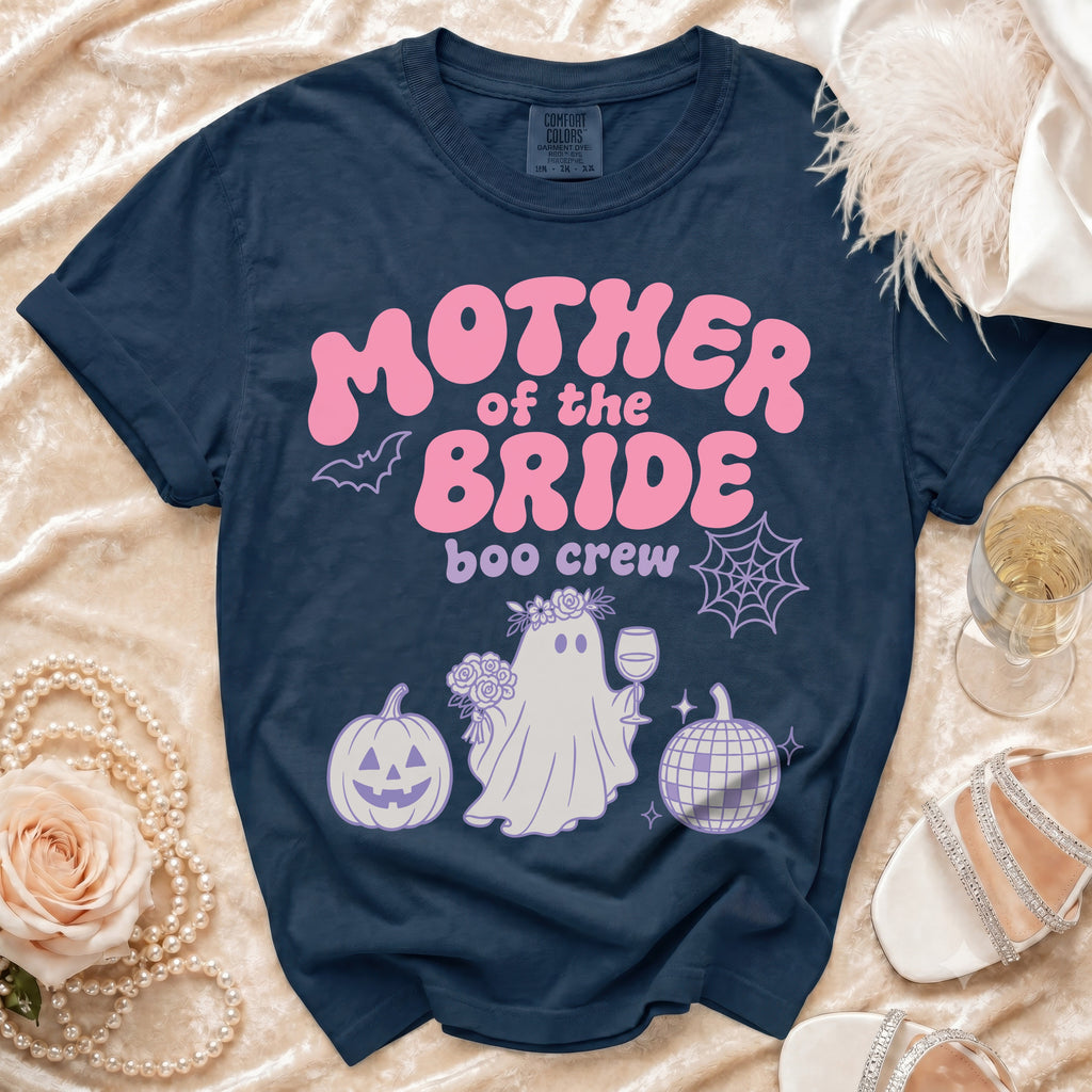 Navy Comfort Colors shirt with pink "Mother of the Bride boo crew" graphic and Halloween motifs.