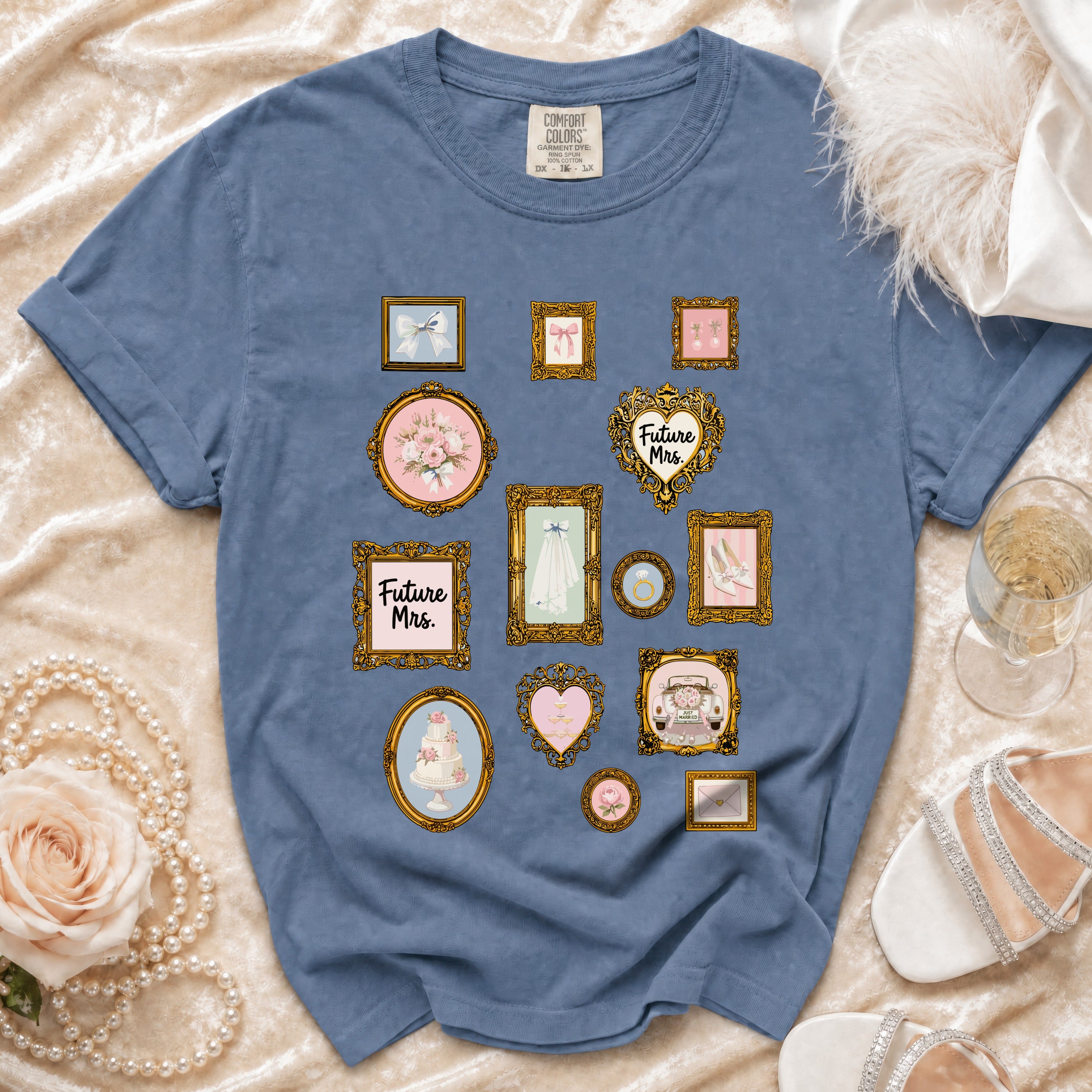 Blue t-shirt with framed wedding icons including a cake, dress, and "Future Mrs." text.