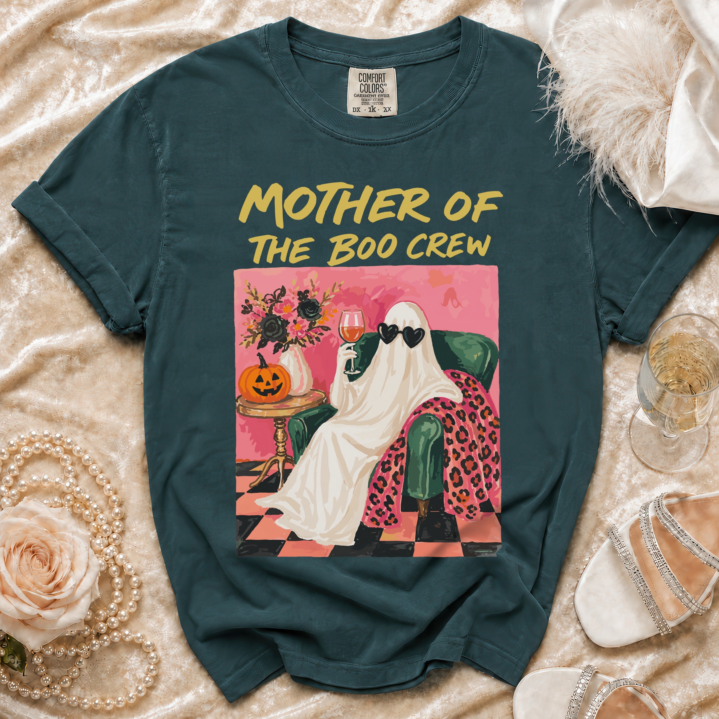 Teal t-shirt with "Mother of the Boo Crew" text and ghost graphic.