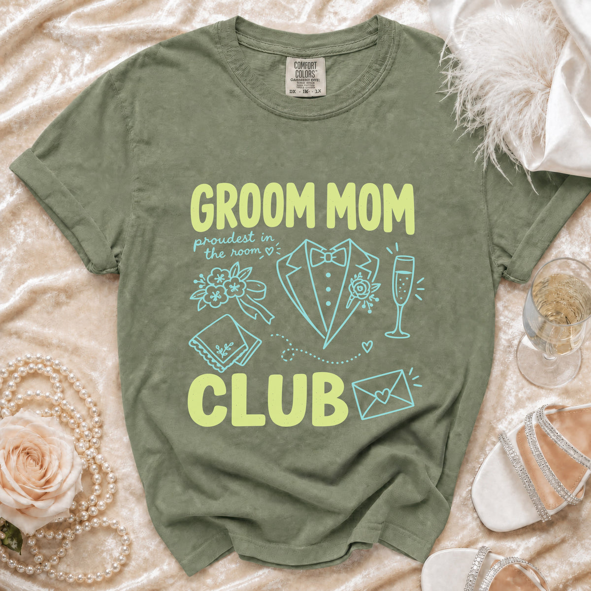 Olive green t-shirt with "GROOM MOM CLUB" text and wedding graphics.