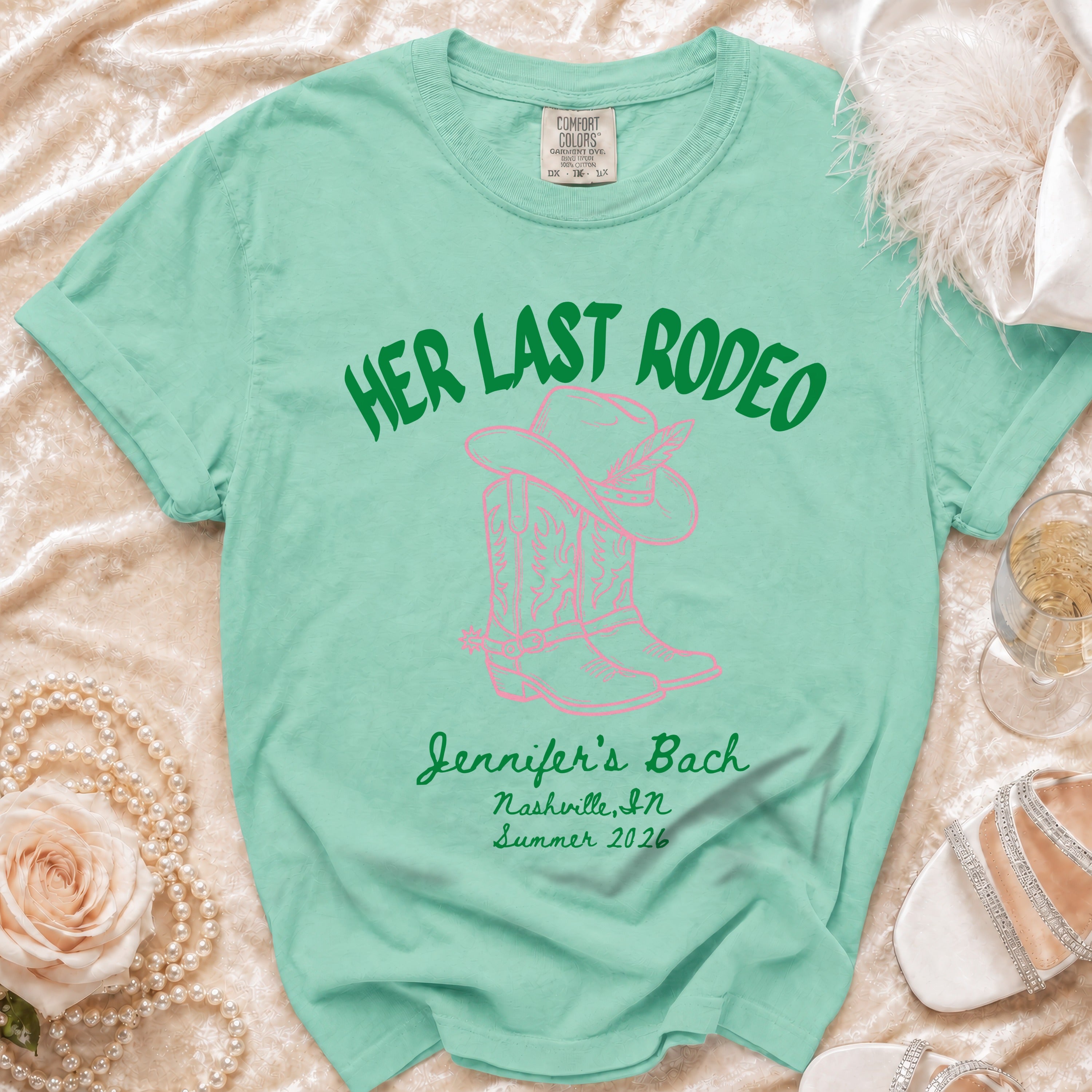 Mint green t-shirt with "Her Last Rodeo" text and cowboy boots.