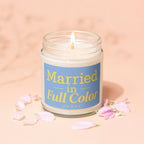 Lit candle with blue label stating "Married in Full Color" and "Vowed".