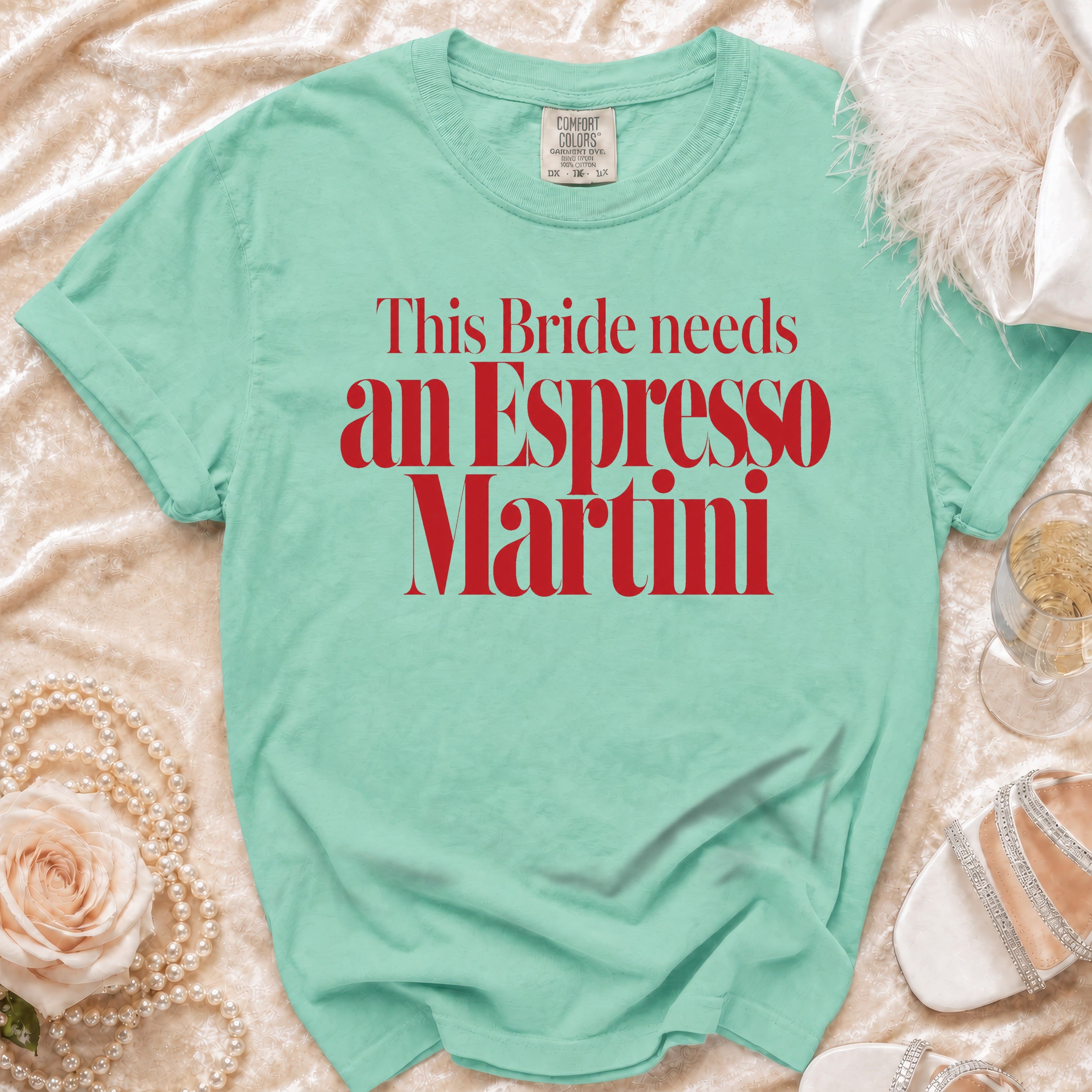 Teal t-shirt with red text reading "This Bride needs an Espresso Martini"