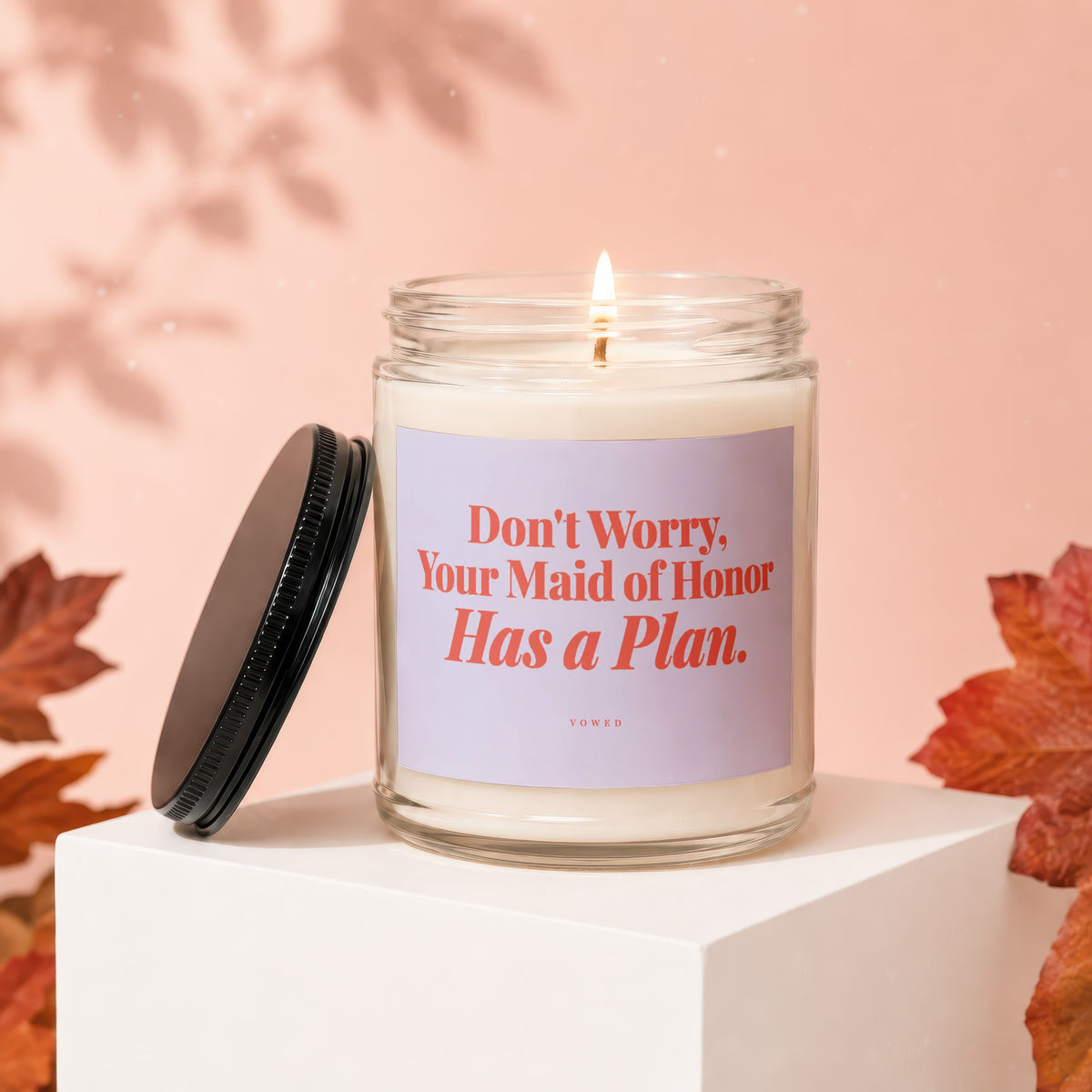 Glass candle with "Don't Worry, Your Maid of Honor Has a Plan" text.