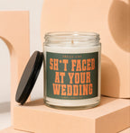 Candle with lid off, showing "Smells like sh*t faced at your wedding" text.
