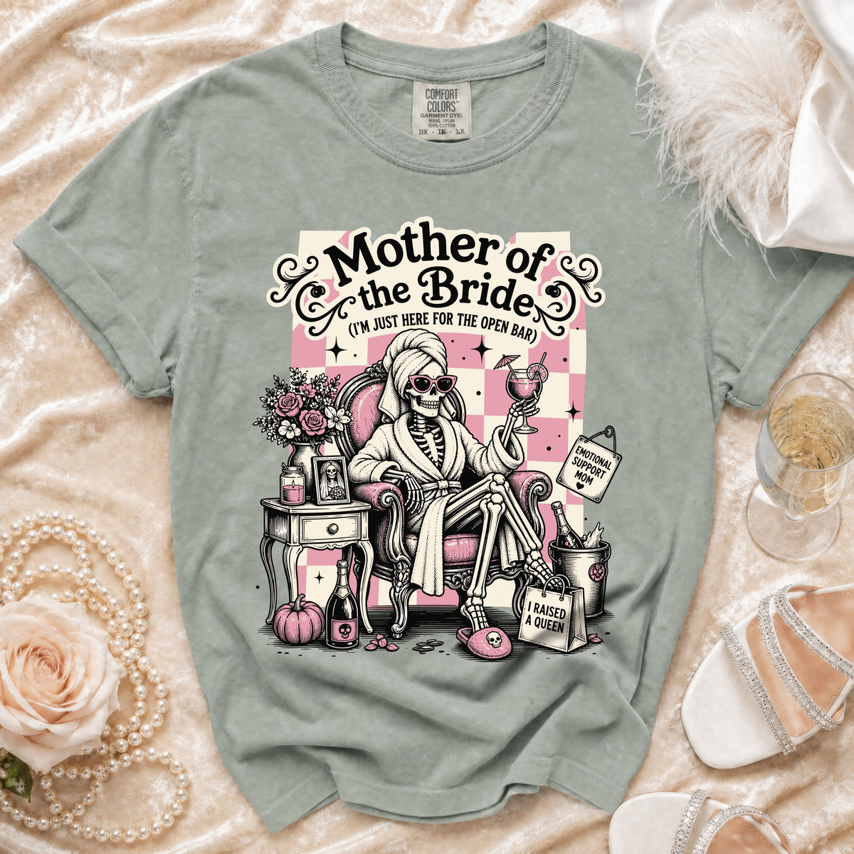 Skeleton wearing robe and sunglasses on t-shirt with "Mother of the Bride" text.
