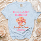 Light blue t-shirt with "Her Last Rodeo" text and cowboy hat graphic.