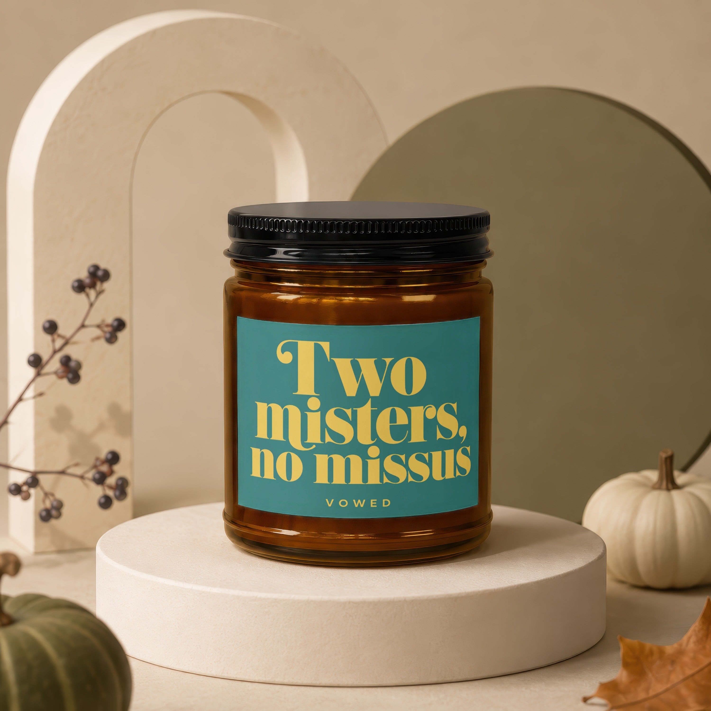 Amber candle with teal label reading "Two misters, no missus" and "VOWED".