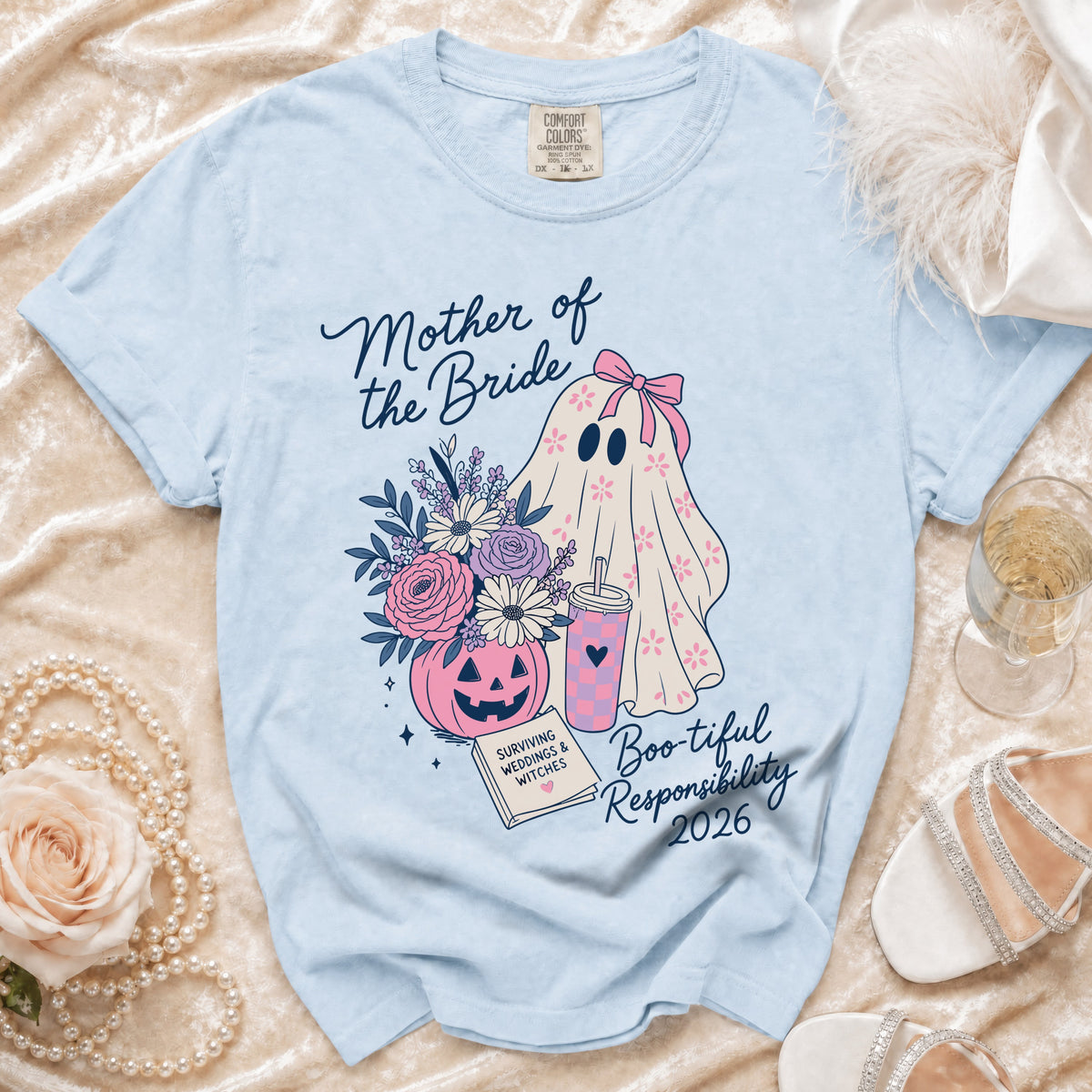 Light blue t-shirt with "Mother of the Bride" and ghost graphic.