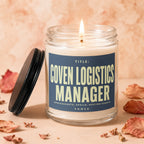 Glass jar candle with lit wick, labeled "Coven Logistics Manager".