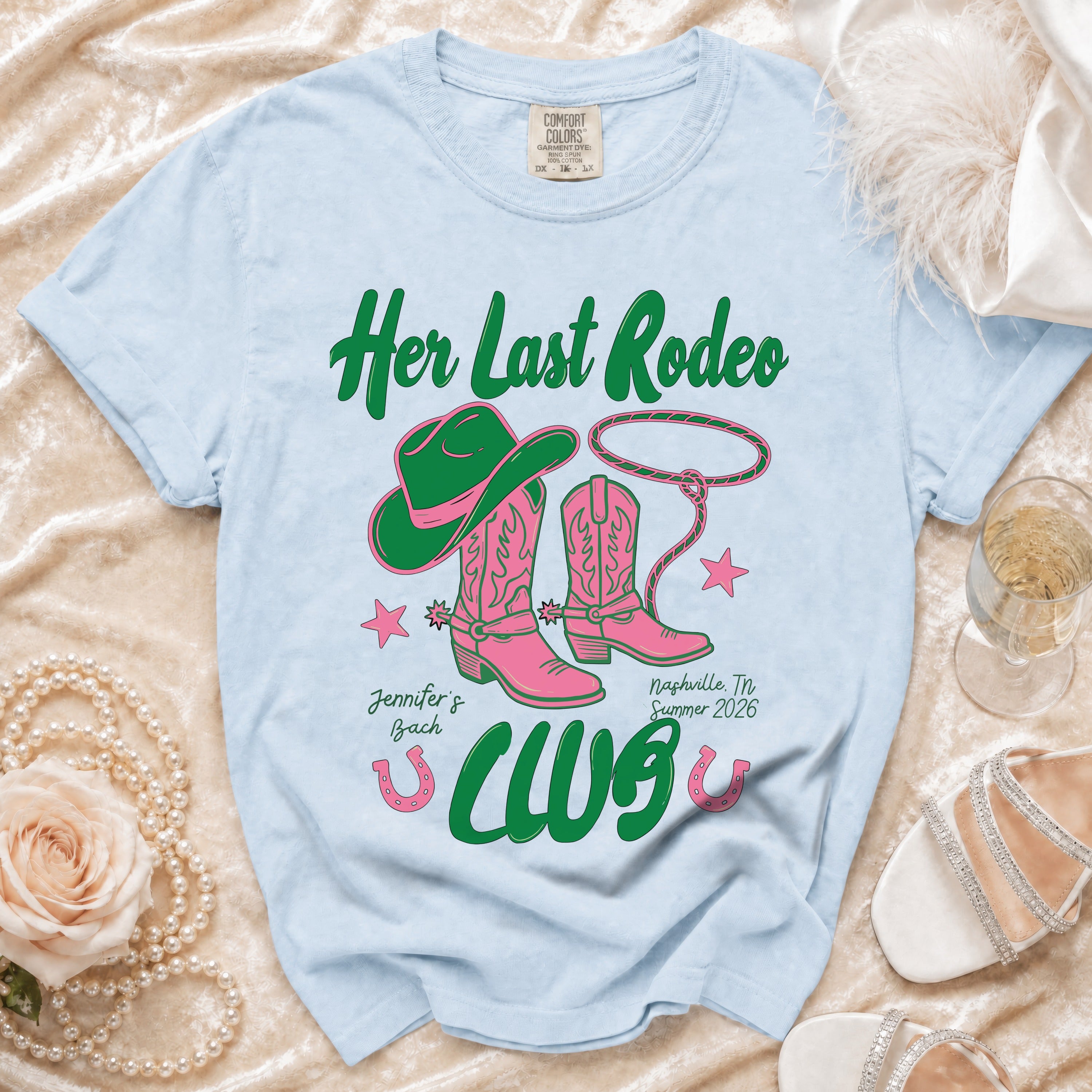 Light blue t-shirt with "Her Last Rodeo" and cowboy boot design.
