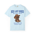 Light blue t-shirt with "Her Last Rodeo" and cowboy boots graphic.