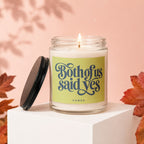 Lit candle in glass jar with "Both of us said yes" text and "VOWED" label.