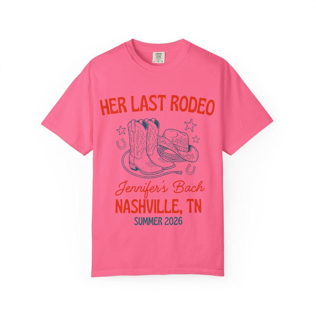 Pink t-shirt with "Her Last Rodeo" text, cowboy boots, and a hat.