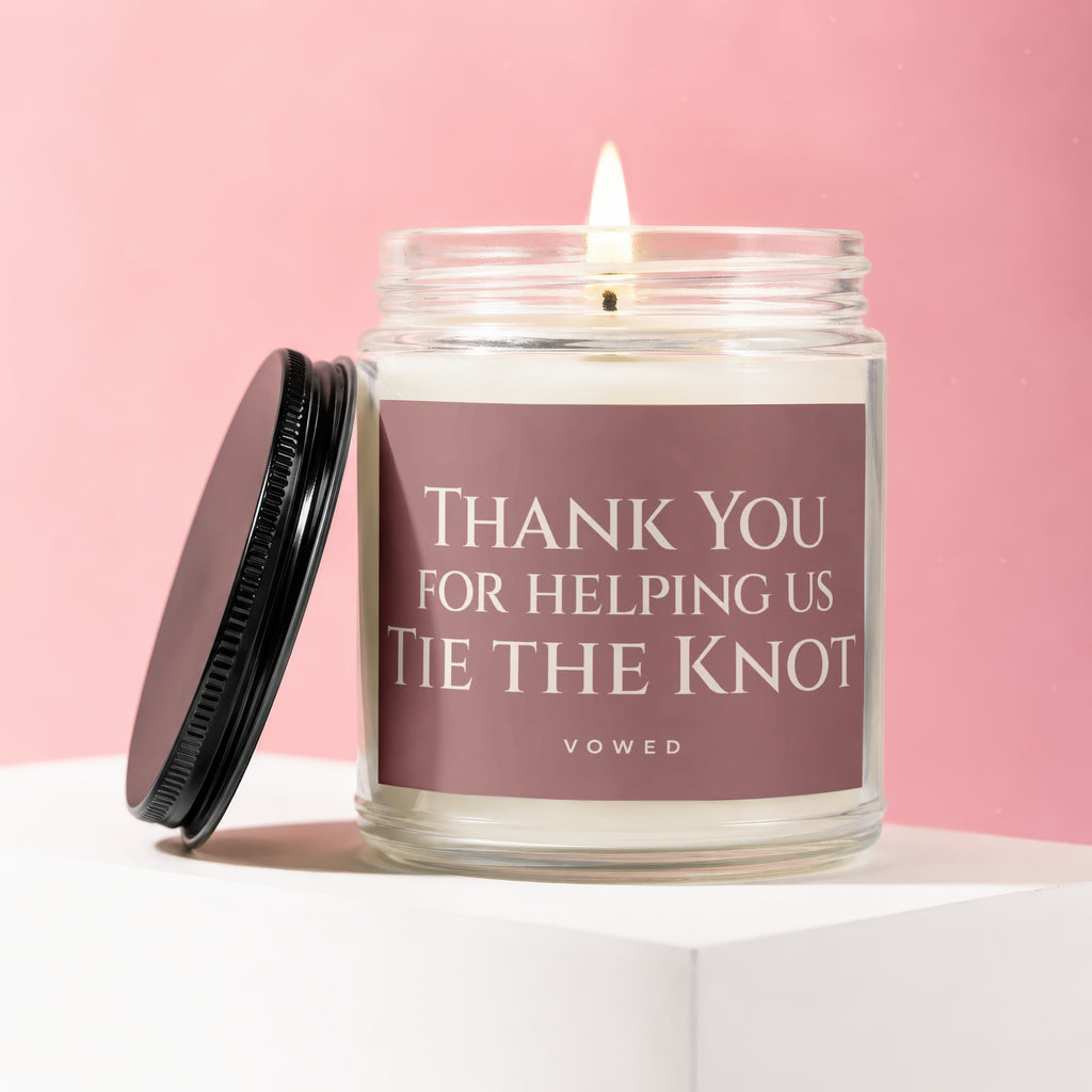 Candle with text "Thank You For Helping Us Tie The Knot" on a pink background.