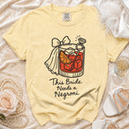 Yellow t-shirt with "This Bride Needs a Negroni" graphic and ring.