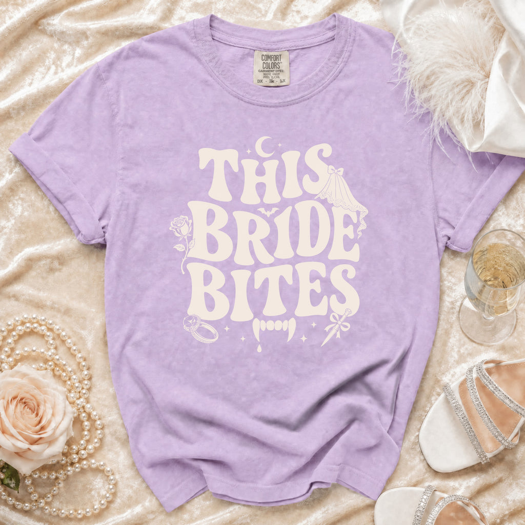 Lavender t-shirt with "THIS BRIDE BITES" text and vampire graphics.