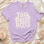 Lavender t-shirt with "THIS BRIDE BITES" text and vampire graphics.