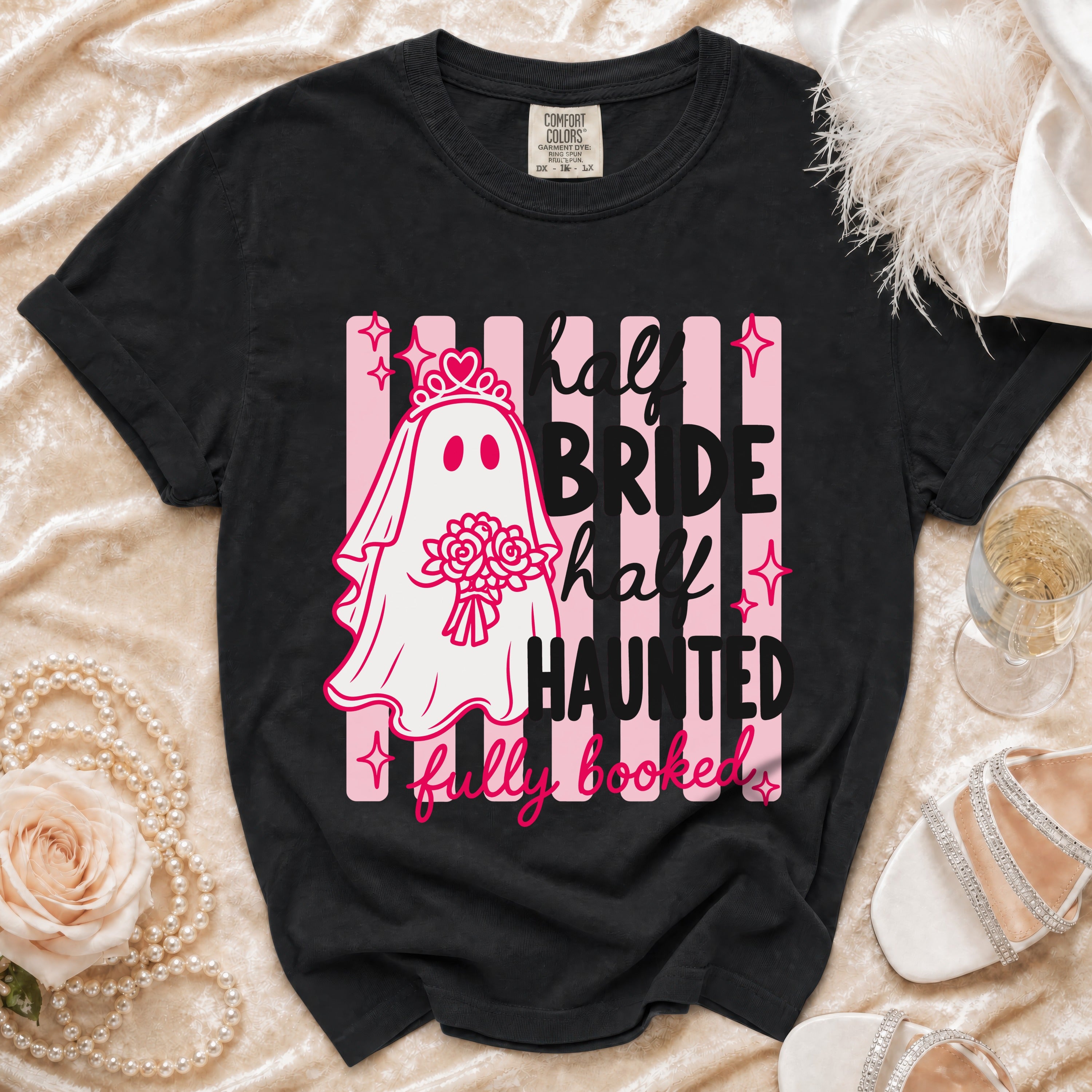 Black t-shirt with ghost bride graphic and text: "half BRIDE half HAUNTED fully booked."