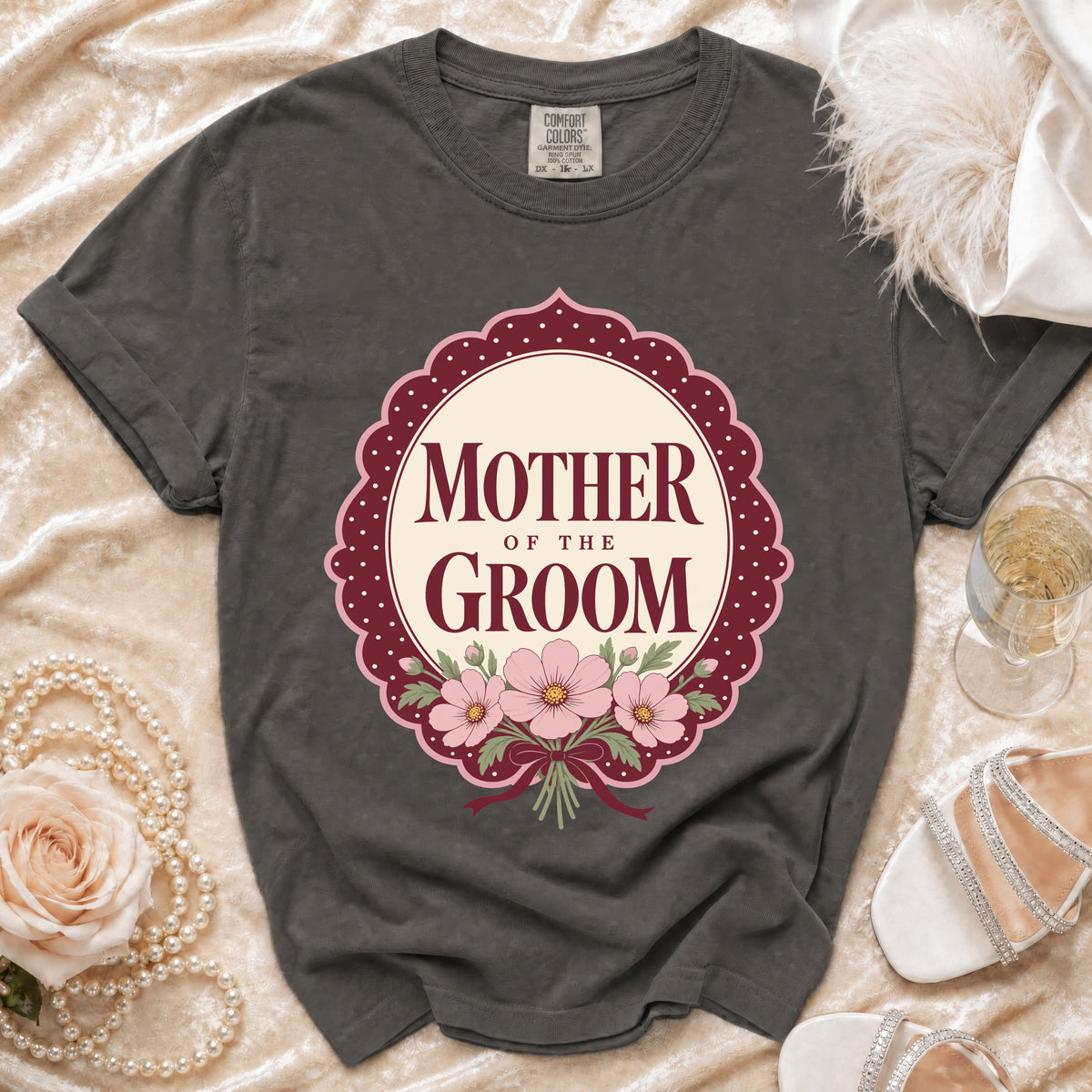 Grey t-shirt with "Mother of the Groom" text and floral design.