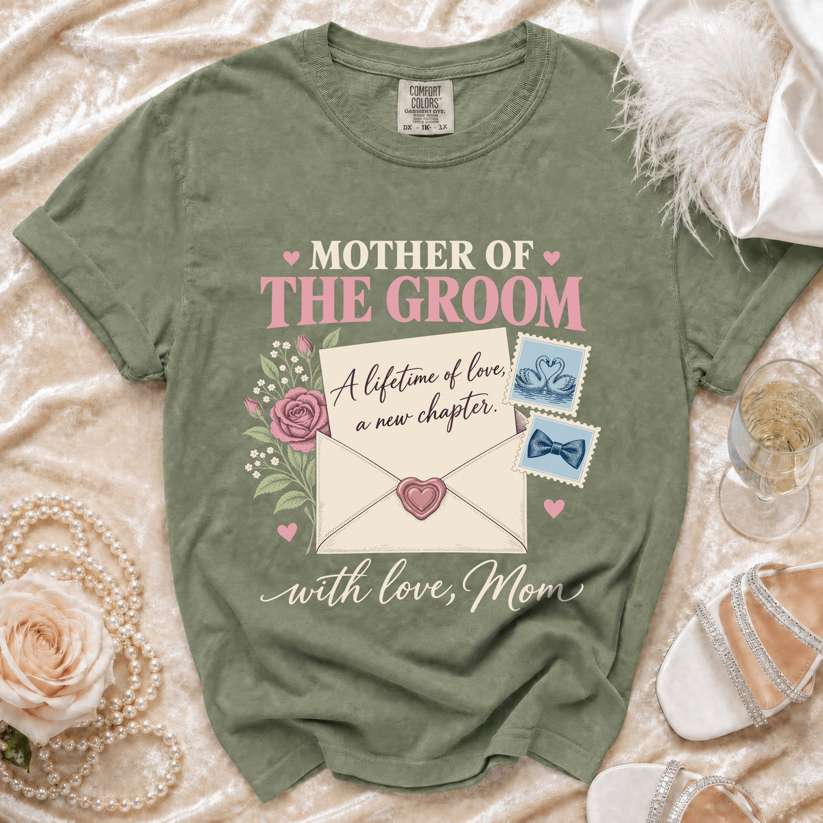 "Mother of the Groom" text on a green t-shirt with floral and letter graphics.