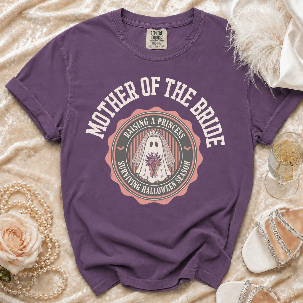 Purple t-shirt with "Mother of the Bride Raising a Princess Surviving Halloween Season" graphic.
