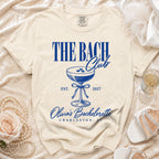 Cream t-shirt featuring blue text reading The Bach Club and Olivia's Bachelorette Charleston, SC.