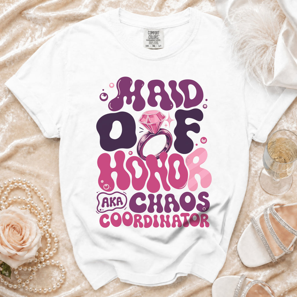 White t-shirt with "Maid of Honor AKA Chaos Coordinator" text and diamond ring graphic.