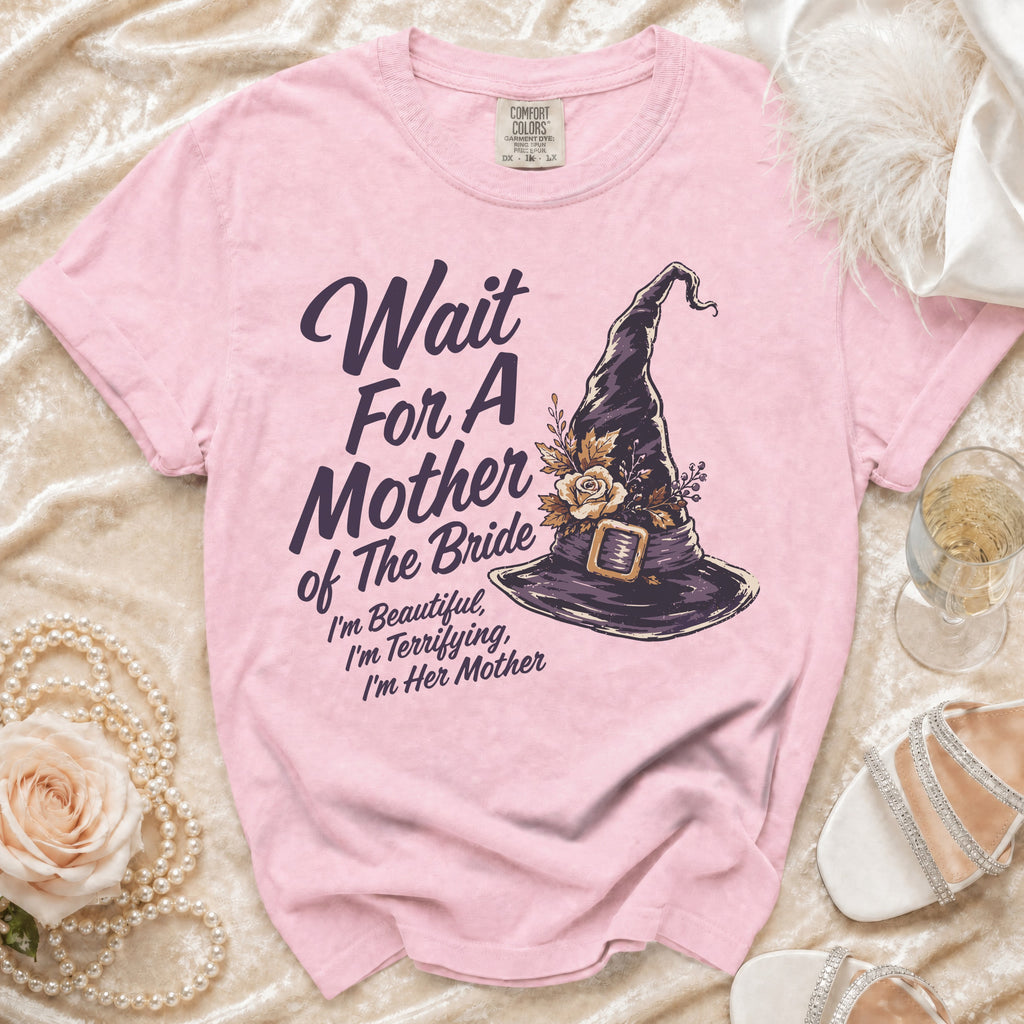 Pink t-shirt with "Wait For A Mother of The Bride I'm Beautiful, I'm Terrifying, I'm Her Mother" and witch hat.