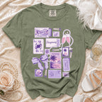 Olive green t-shirt with "Honeymooning" graphics and travel-themed illustrations.