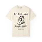 Cream t-shirt with "Her Last Rodeo" and cowboy boot graphic.