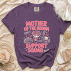 Purple t-shirt with "MOTHER OF THE GROOM SUPPORT SQUAD" text and graphics.