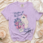 Purple t-shirt with a ghost, pumpkin, flowers, and text "Mother of the Bride" and "Boo-tiful Responsibility 2026".