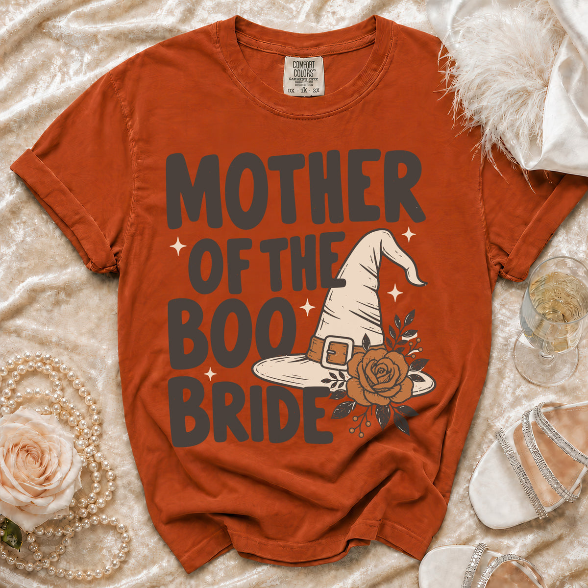 Orange t-shirt with "Mother of the Boo Bride" text and witch hat graphic.