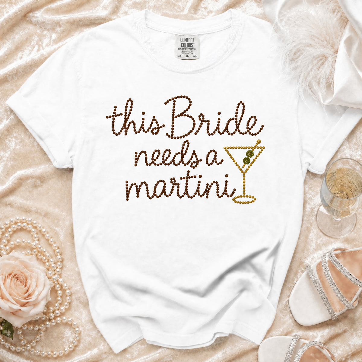 White t-shirt with "this Bride needs a martini" text and a martini glass graphic.