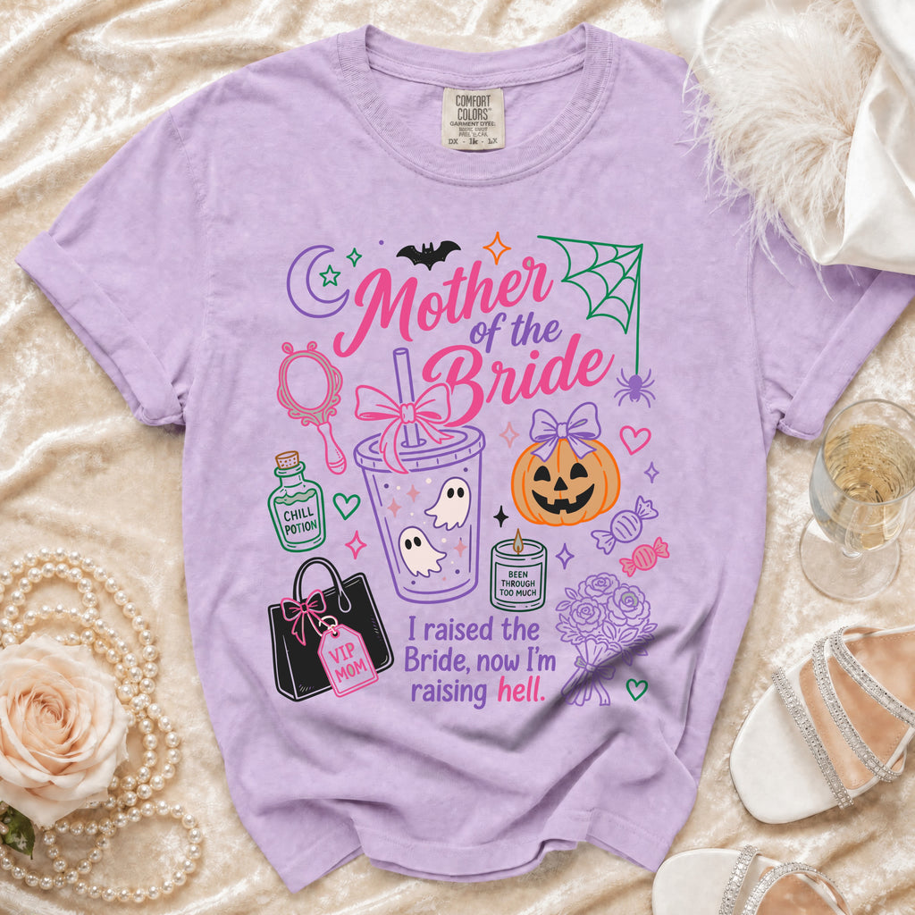 Purple t-shirt with "Mother of the Bride, I raised the Bride, now I'm raising hell" text and graphics.