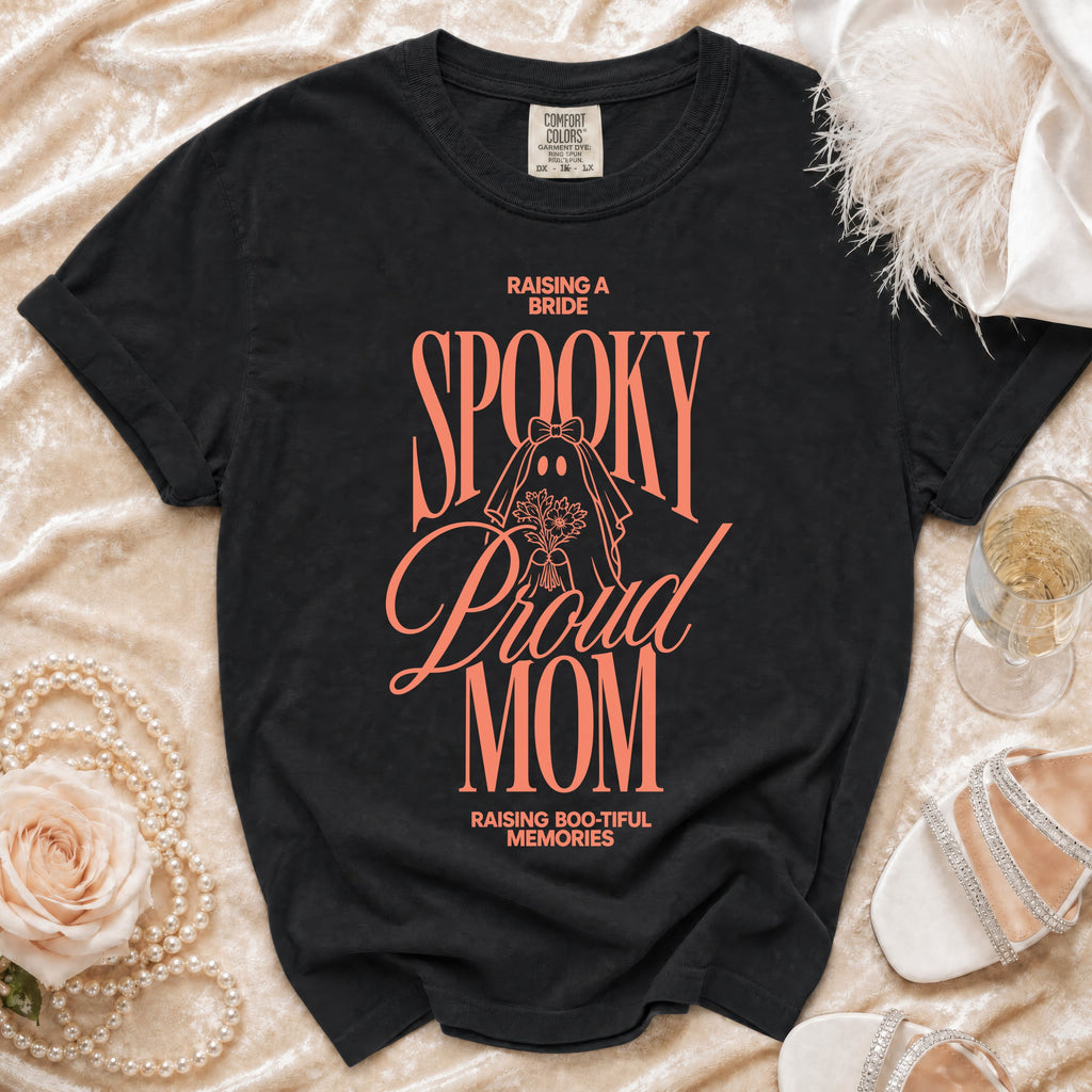 Black t-shirt with "Raising a Bride Spooky Proud Mom Raising Boo-tiful Memories" text.