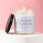Candle with "To the family I married into" text on a pink background.
