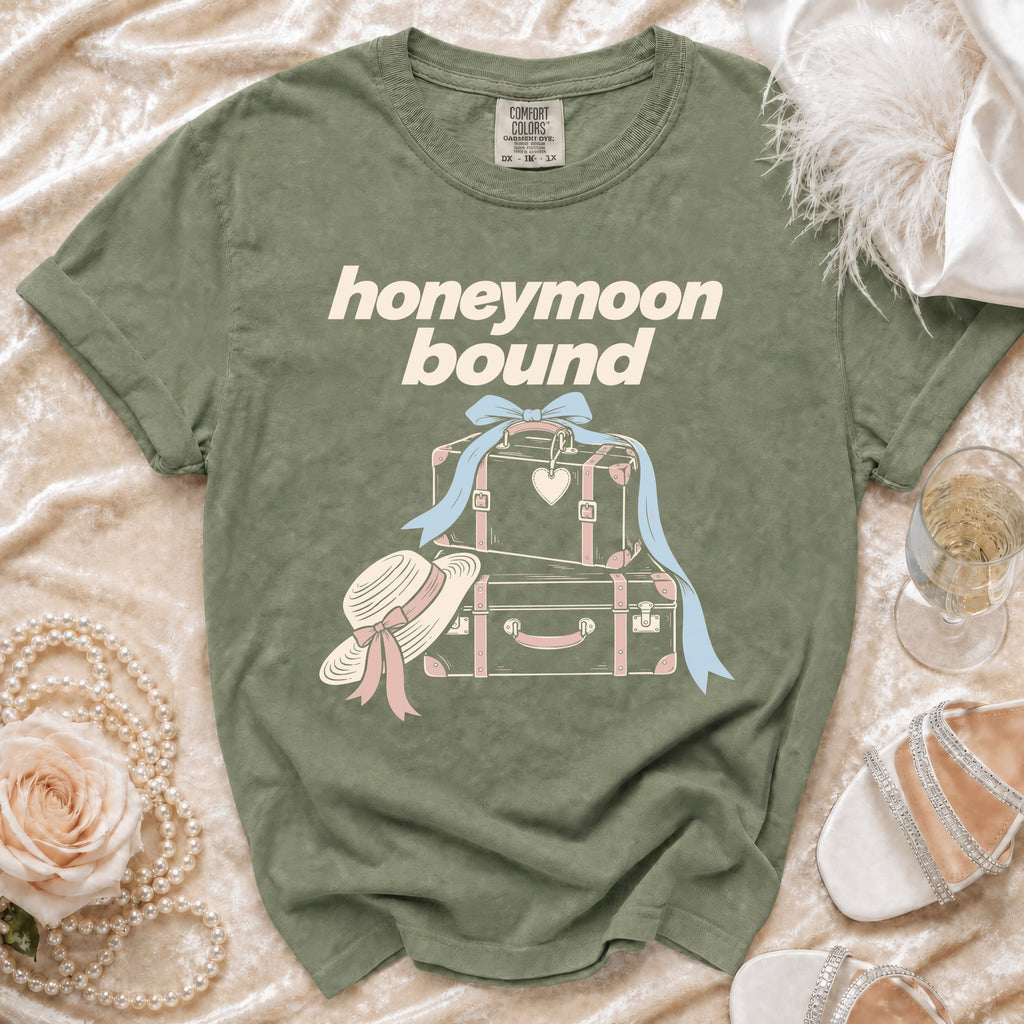 Olive green t-shirt with "honeymoon bound" text and suitcases graphic.
