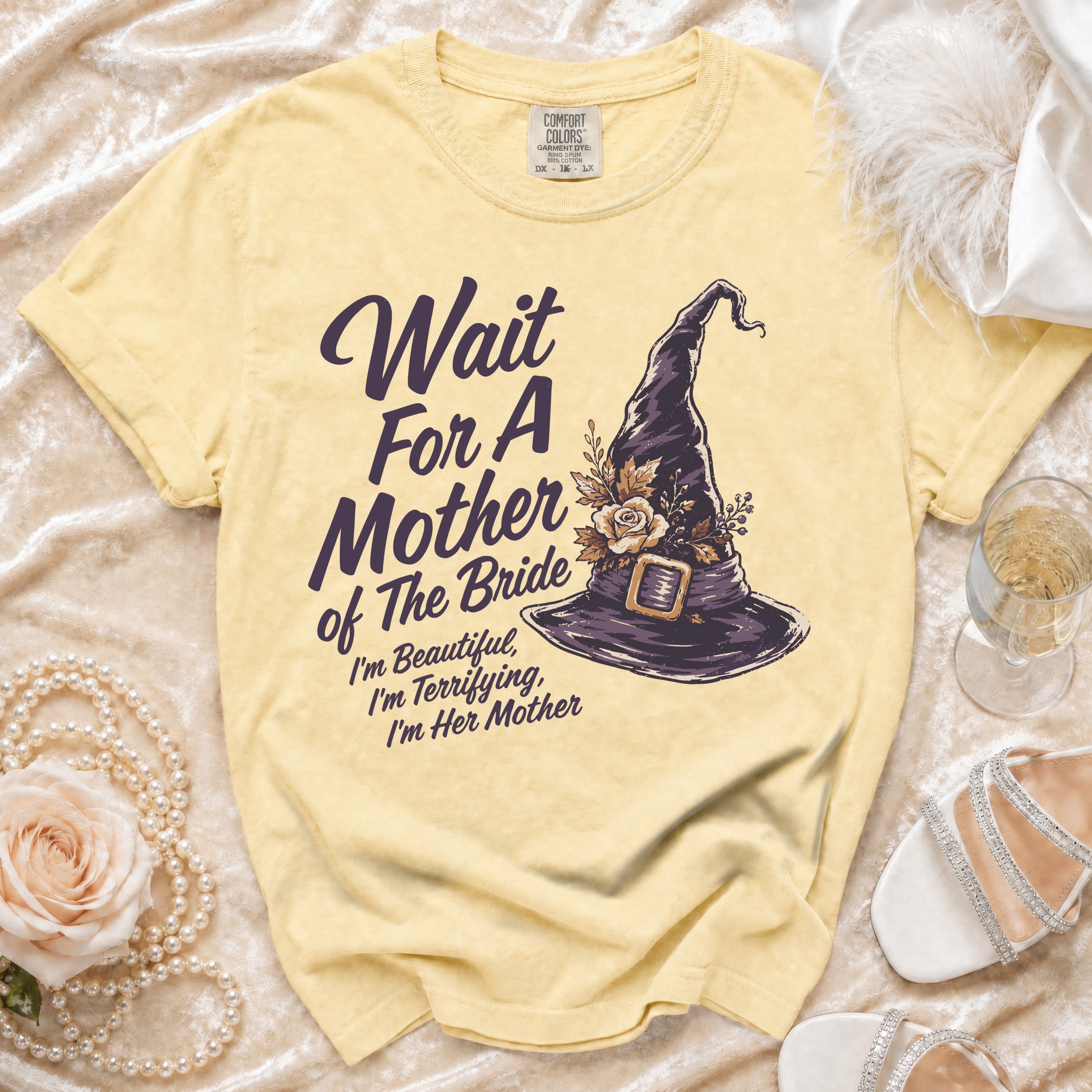 Yellow t-shirt with "Wait For A Mother of The Bride" and witch hat graphic.