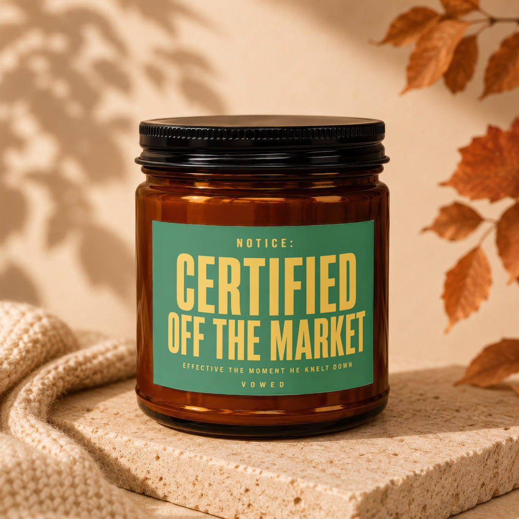 Amber jar candle with green label reading "Certified Off the Market"