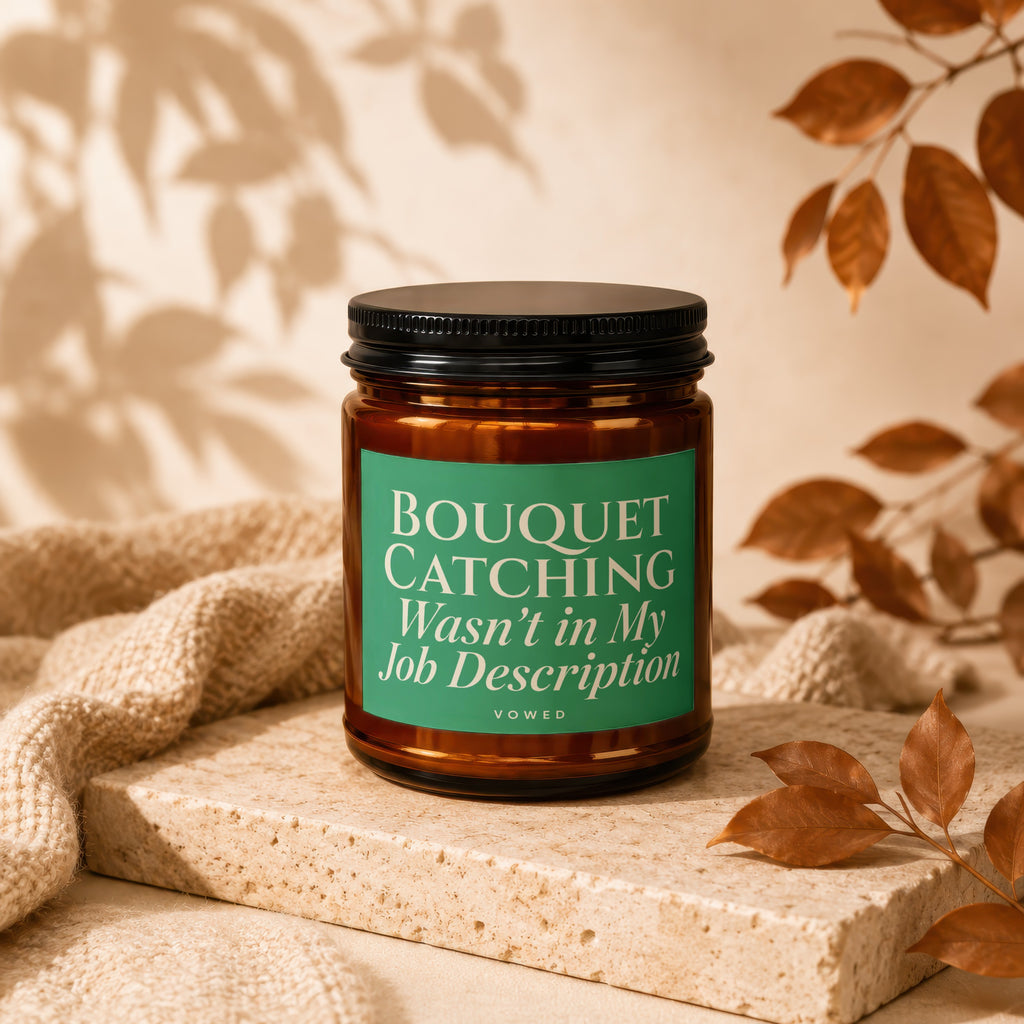 Amber candle with green label reading "BOUQUET CATCHING Wasn't in My Job Description."