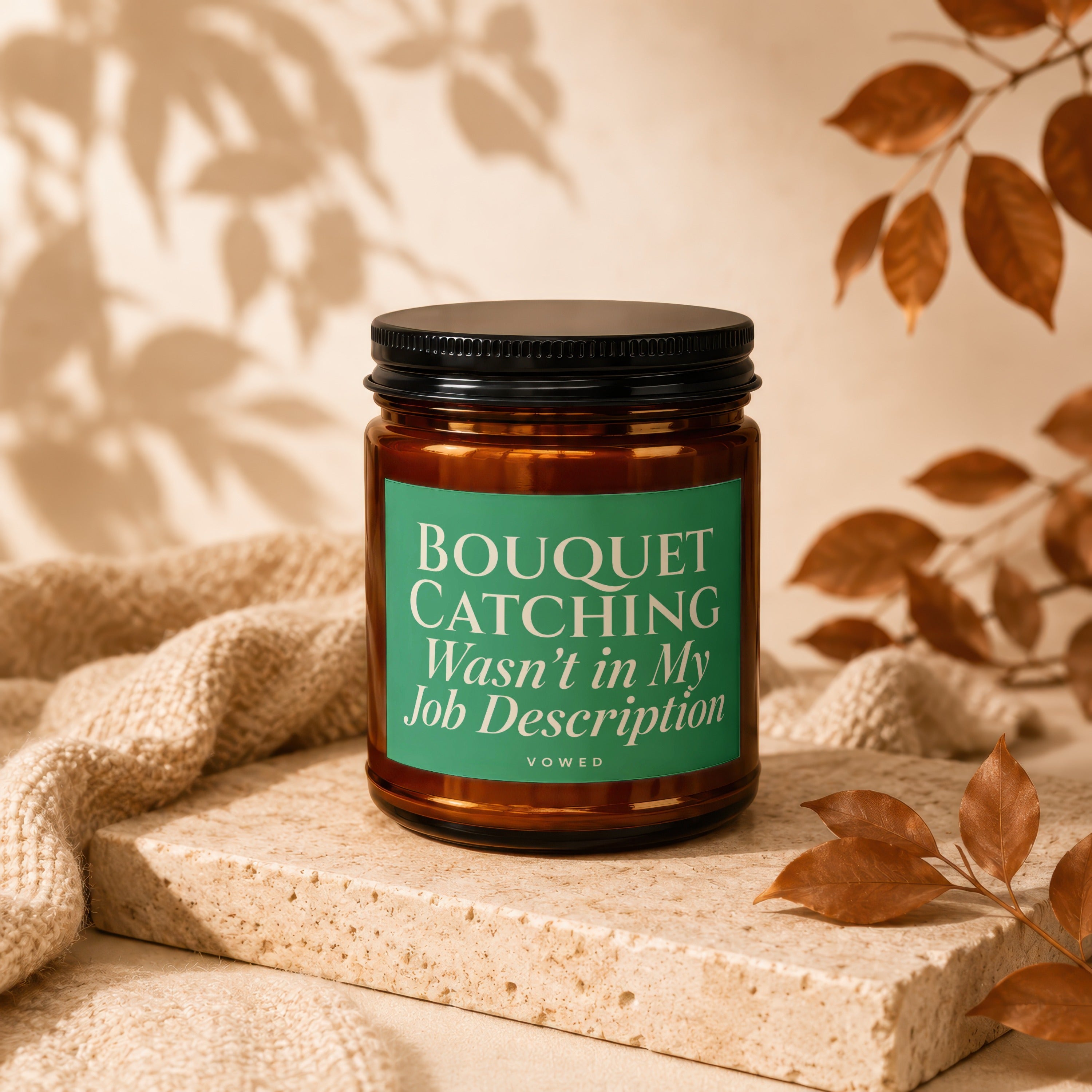 Amber candle with green label reading "BOUQUET CATCHING Wasn't in My Job Description."