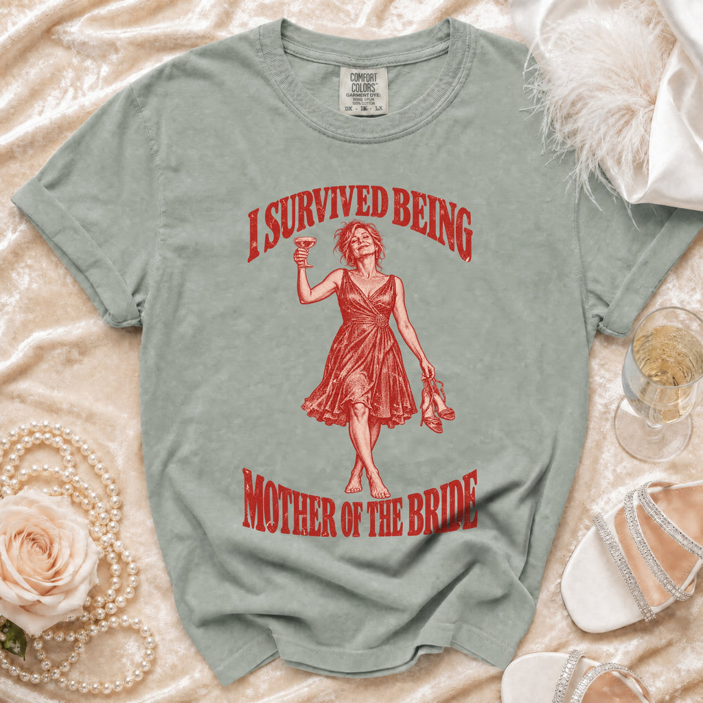 T-shirt with red graphic of woman holding cocktail and text "I SURVIVED BEING MOTHER OF THE BRIDE".