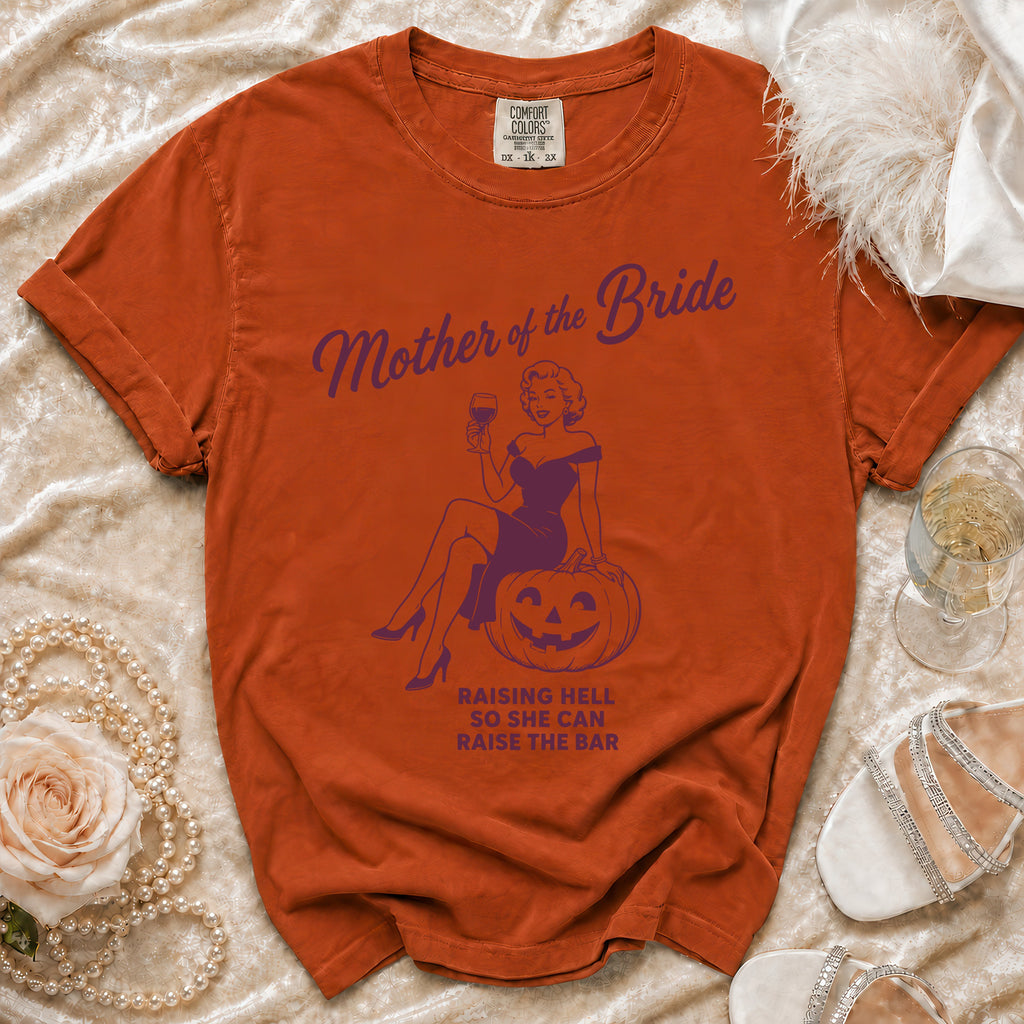 Orange t-shirt with "Mother of the Bride" graphic and text.