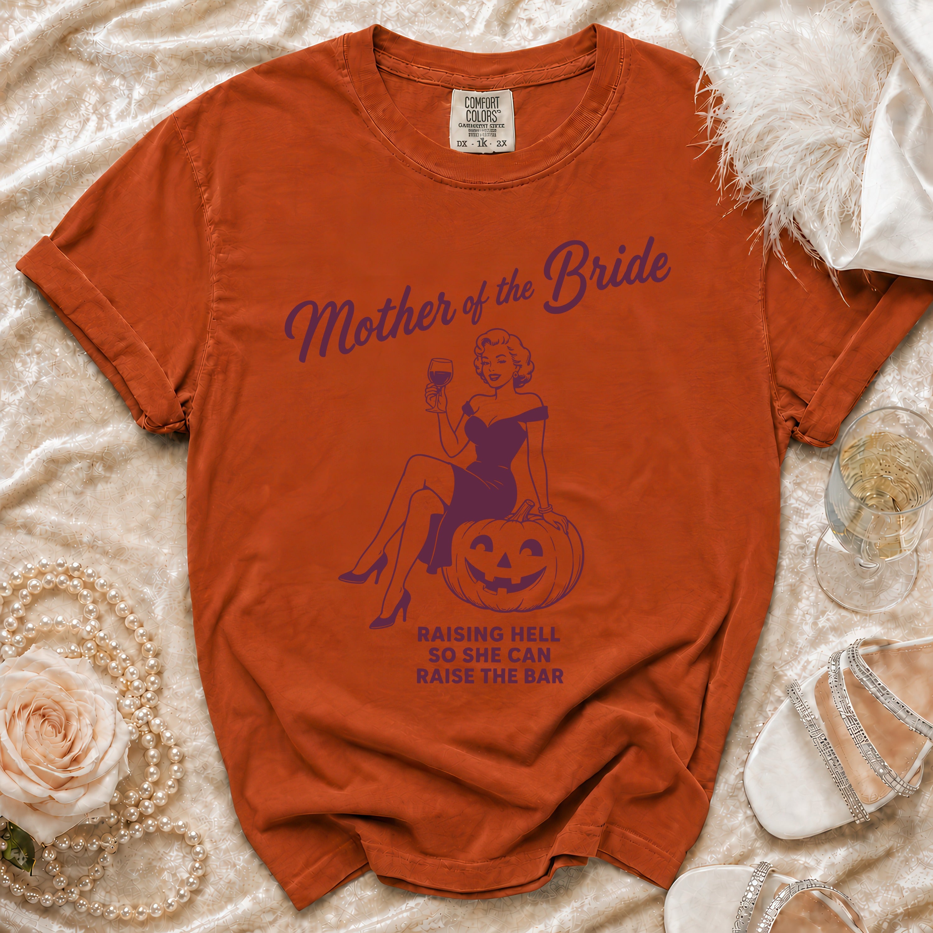 Orange t-shirt with "Mother of the Bride" graphic and text.