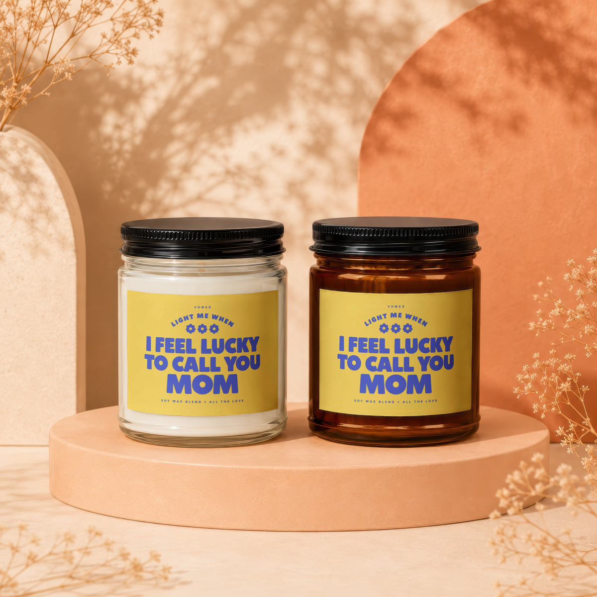 Two candles with yellow labels reading "I feel lucky to call you Mom."