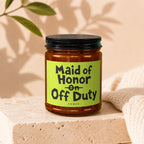 Candle with label reading "Maid of Honor on Off Duty VOWED."